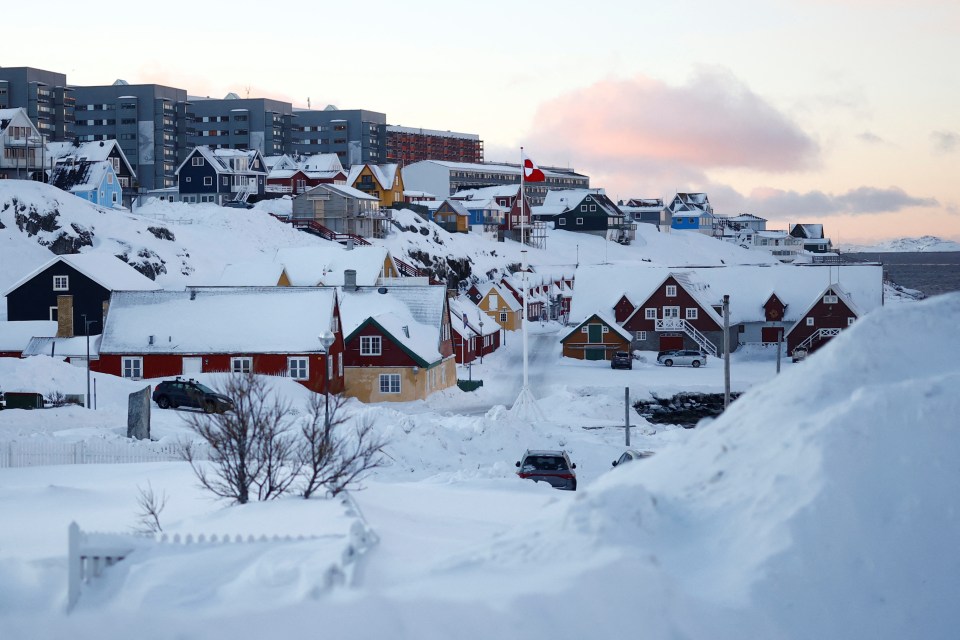 Snow-covered houses and buildings in Nuuk, Greenland.