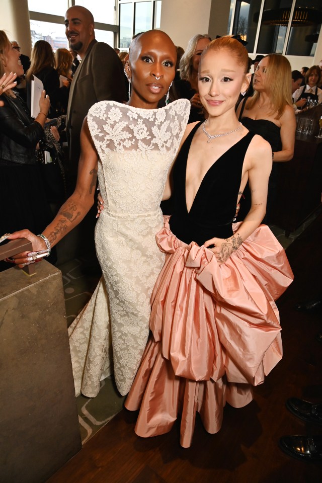 Cynthia Erivo and Ariana Grande at a champagne reception.