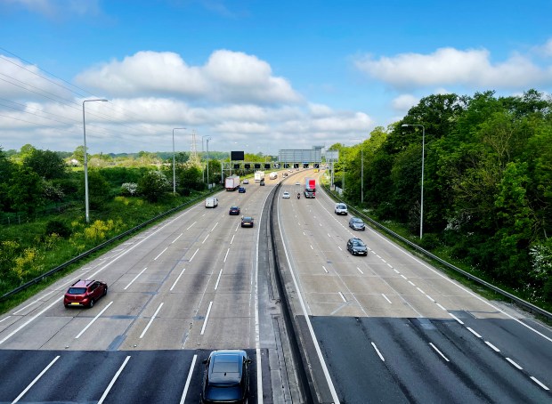 Cars driving on a multi-lane highway.