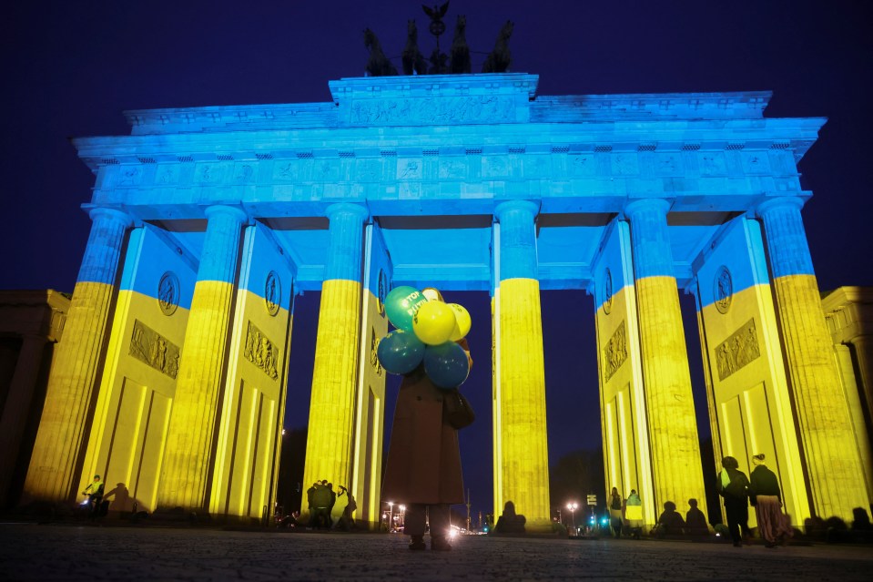 The Brandenburg Gate in Berlin illuminated in the colors of the Ukrainian flag.