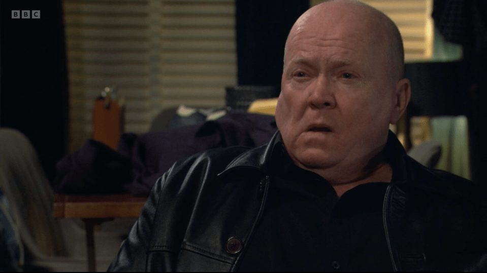 Screenshot of a man in a black leather jacket.