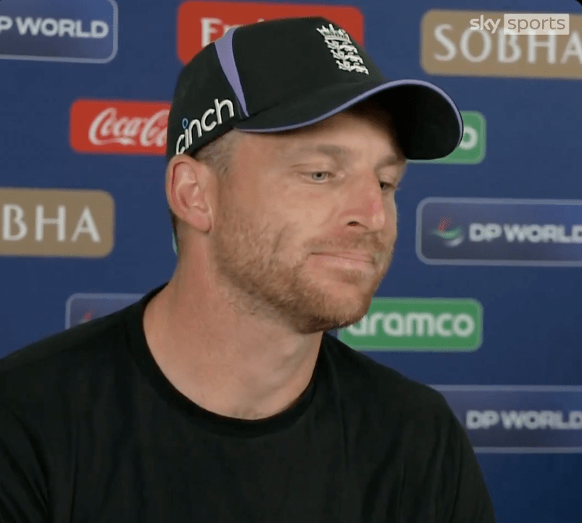 Close-up of a man wearing a black England cricket cap.