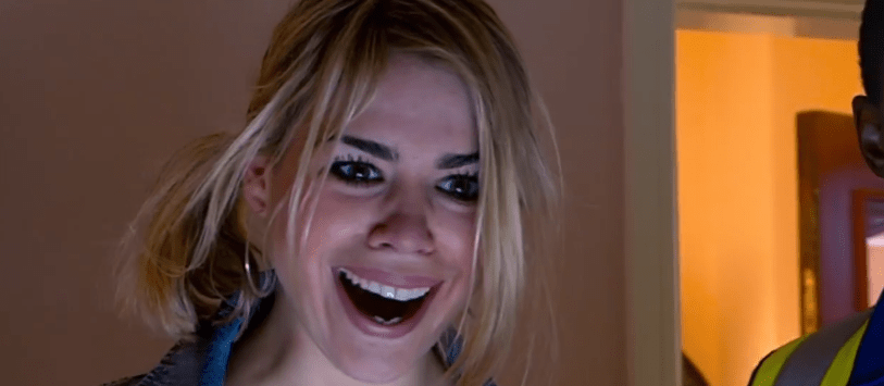 Screenshot of a woman laughing.