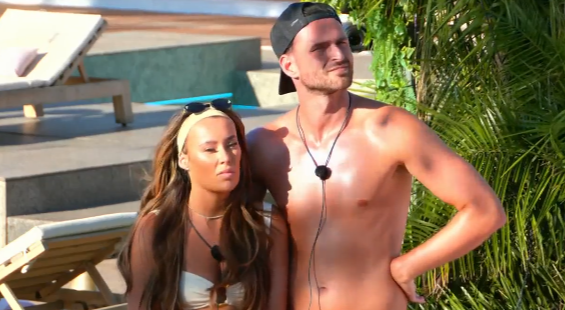 Screenshot of a man and woman in swimwear.