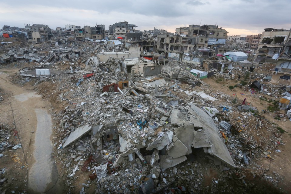 Aerial view of destroyed buildings and makeshift tents in Gaza.