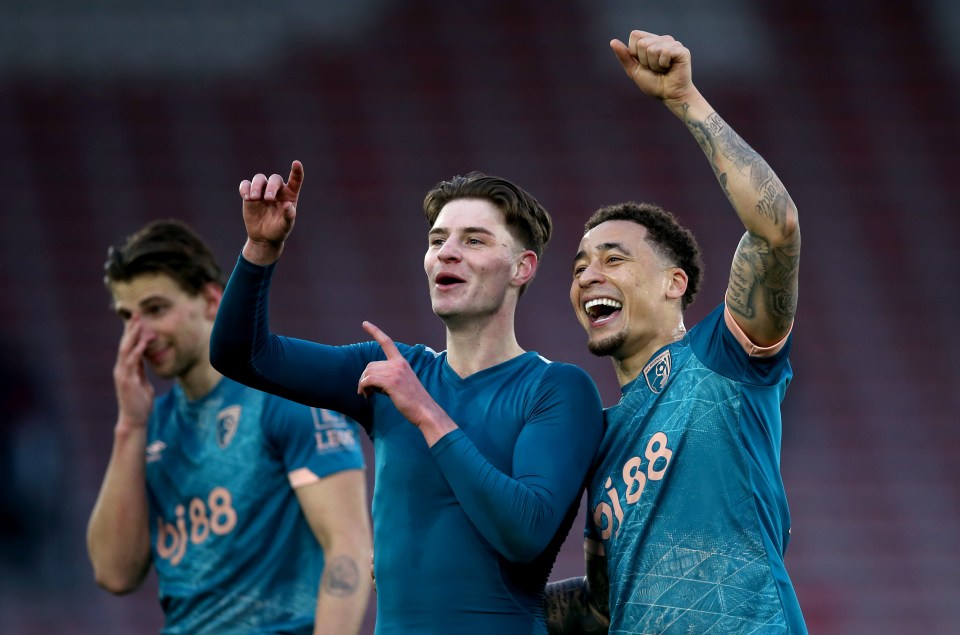 Alex Scott and Marcus Tavernier of AFC Bournemouth celebrating a victory.