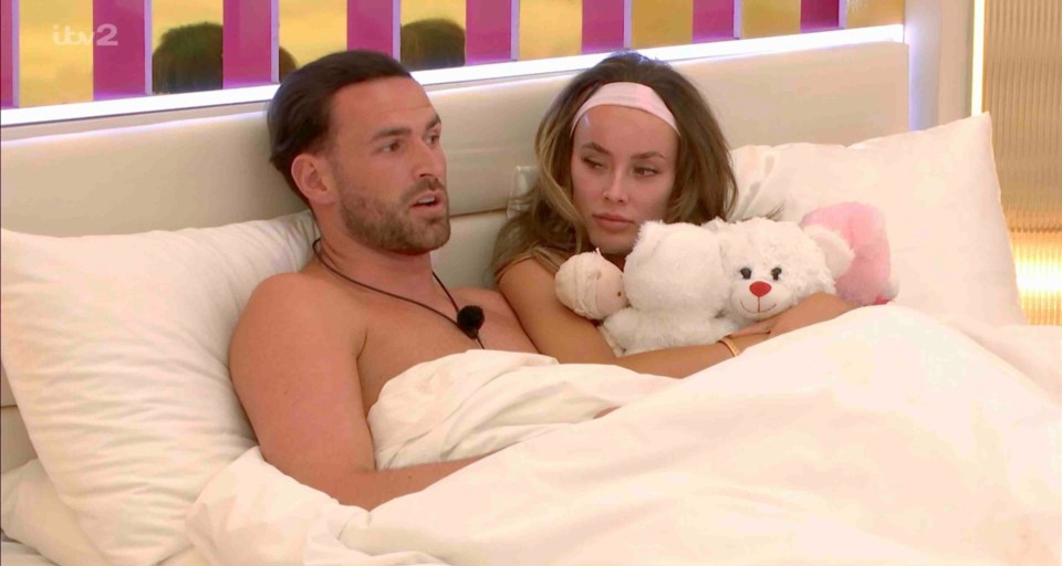 Couple in bed together.