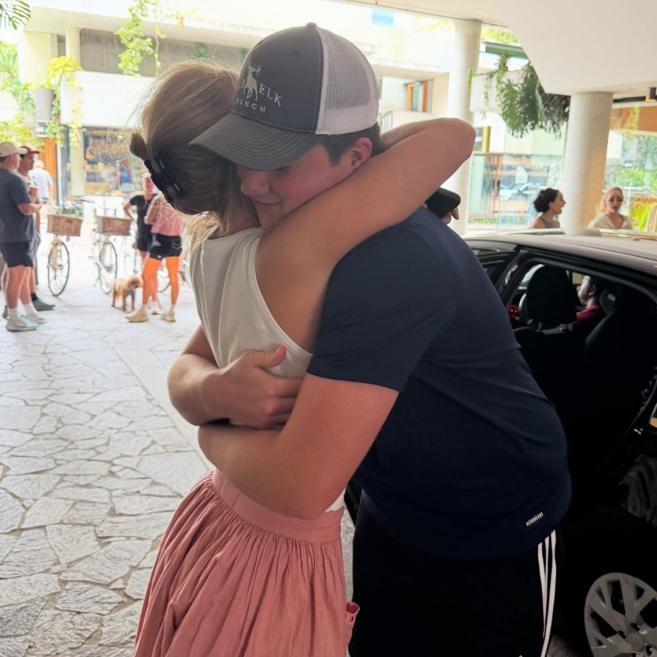 Two people hugging.
