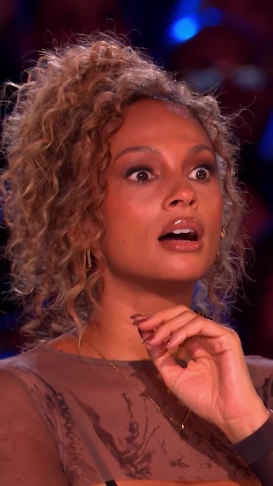 Close-up of a surprised woman.