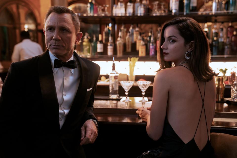 James Bond and Paloma at a bar in No Time To Die.
