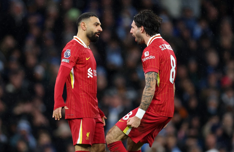 Liverpool's Szoboszlai and Salah celebrating a goal.