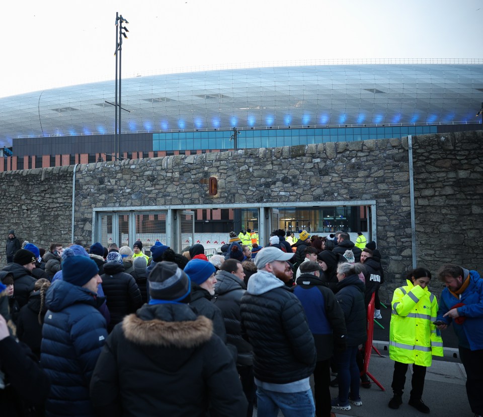 epa11903380 Fans queue to enter Evertons Bramley Moore Dock stadium in Liverpool, Britain, 17 February 2025. A test event is to be played by Everton Under-18s against Wigan Athletic under-18s at the clubs new 52,888 capacity Bramley Moore Dock stadium, which has been built to replace their current ground at Goodison Park. This first test event, held in front of 10,000 spectators, will allow the club to obtain licenses and safety certificates to operate at full capacity as a Premier League stadium from the 2025/2026 season. EPA/ADAM VAUGHAN