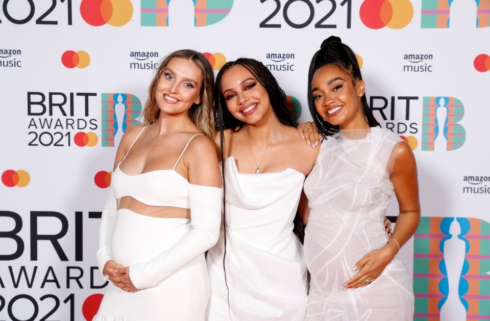 FILE - AUGUST 22, 2021: Pop Star Perrie Edwards of Little Mix and footballer Alex Oxlade-Chamberlain of Liverpool FC have announced the birth of their first child. LONDON, ENGLAND - MAY 11: Perrie Edwards, Jade Thirlwall and Leigh-Anne Pinnock of Little Mix pose in the media room during The BRIT Awards 2021 at The O2 Arena on May 11, 2021 in London, England. (Photo by JMEnternational/JMEnternational for BRIT Awards/Getty Images)