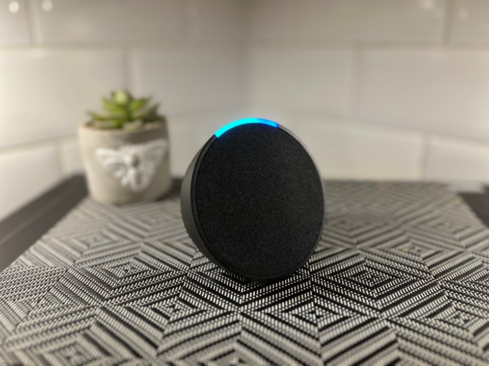 Echo Pop smart speaker with blue light.