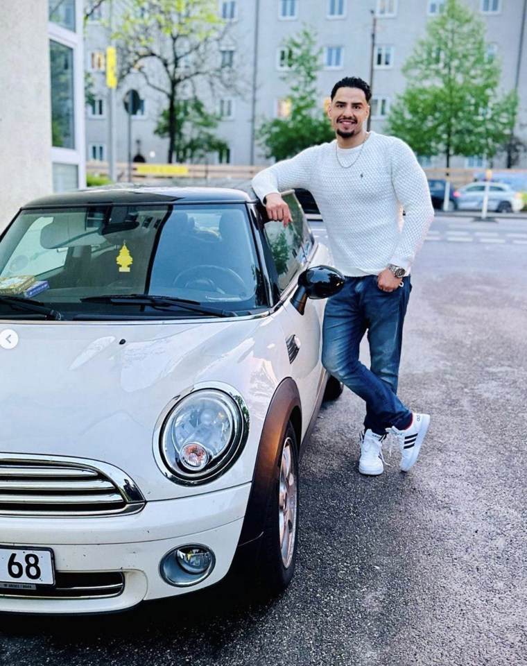 Farhad Noori, a 24-year-old Afghan asylum seeker, posing next to a white Mini Cooper.