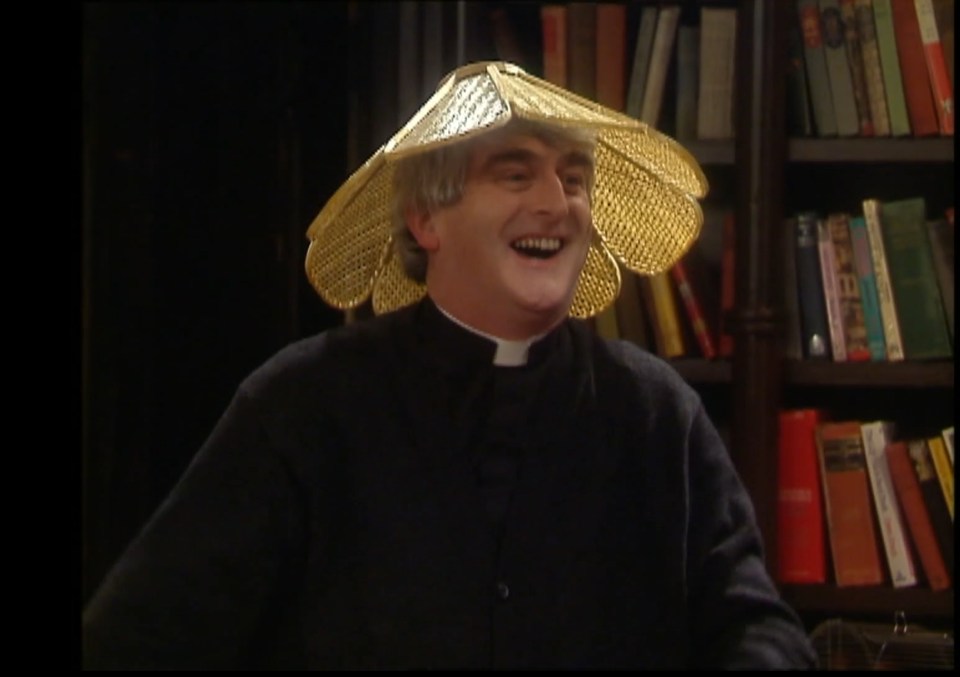 Father Ted wearing a large, ornate hat.