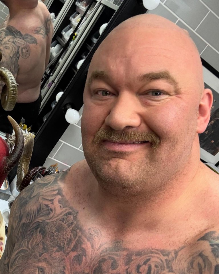Hafþór Júlíus Björnsson with a bald head and mustache.