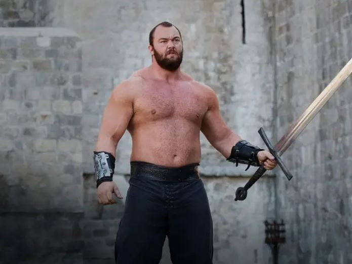 Hafþór Júlíus Björnsson holding a sword.