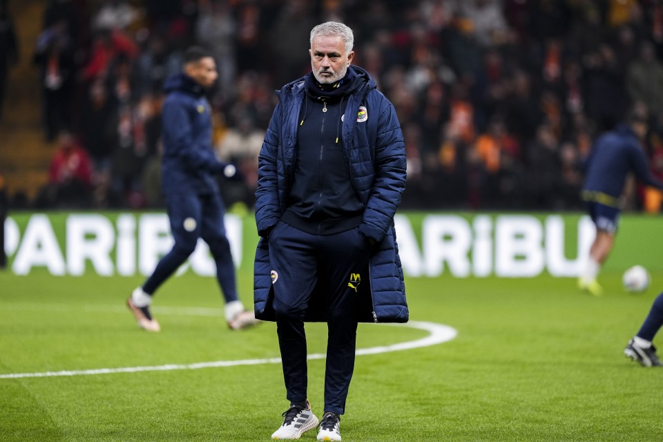 Jose Mourinho, head coach of Fenerbahce, on a soccer field.