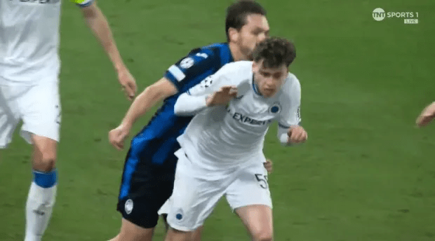 Soccer players vying for the ball.