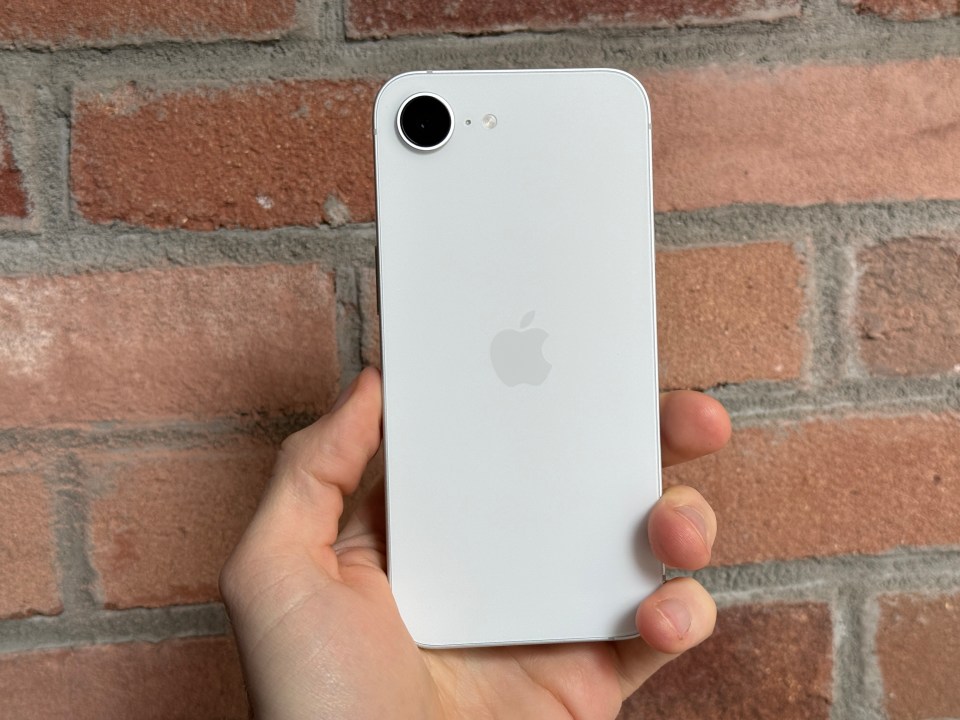 White iPhone held in hand.