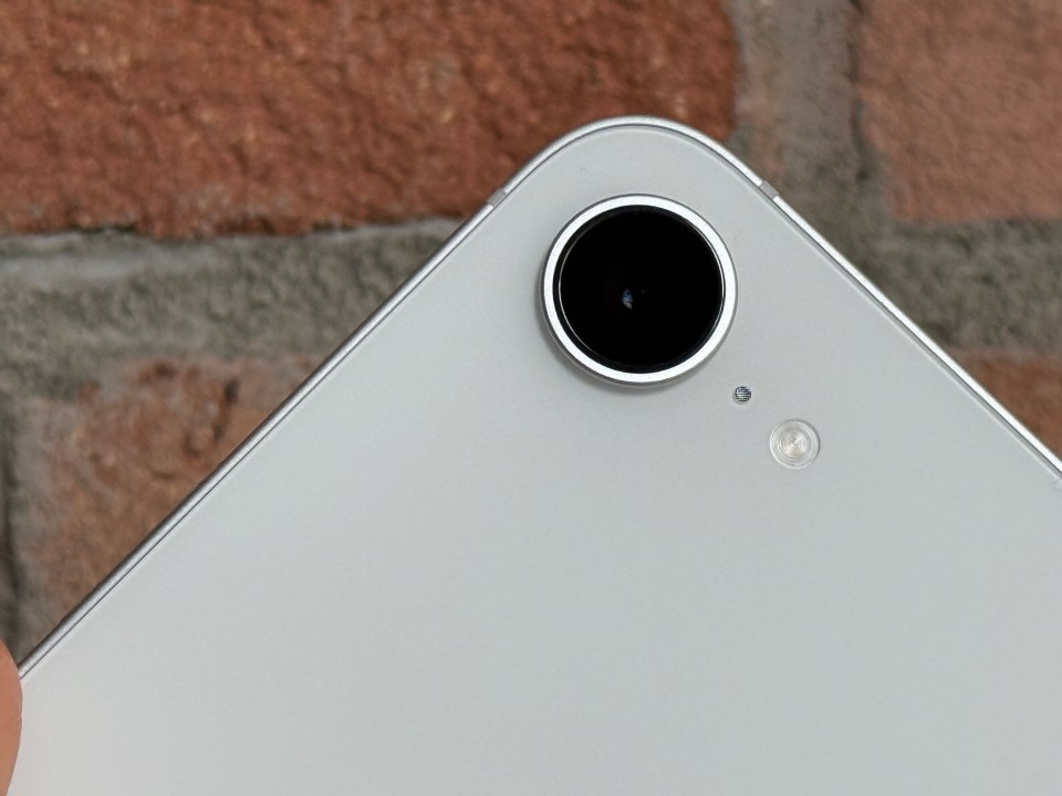 Close-up of a smartphone's camera lens.