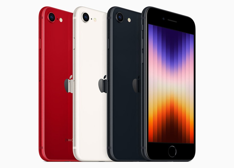 Three iPhones in red, white, and black.