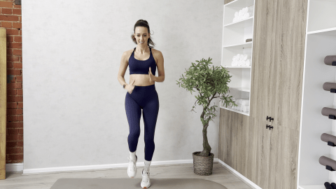 Woman in athletic wear performing a jumping exercise.