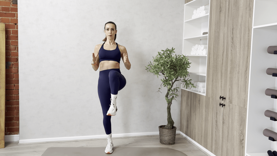 Woman demonstrating a leg raise exercise.