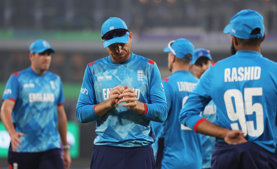Jos Buttler, captain of the England cricket team, walks off the field.