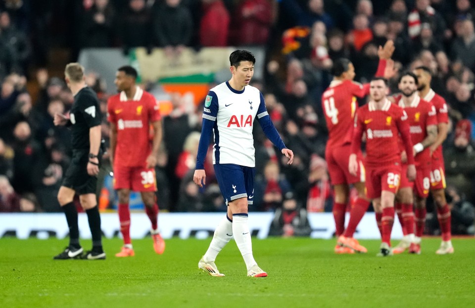 Son Heung-Min looking dejected as Liverpool celebrates a goal.