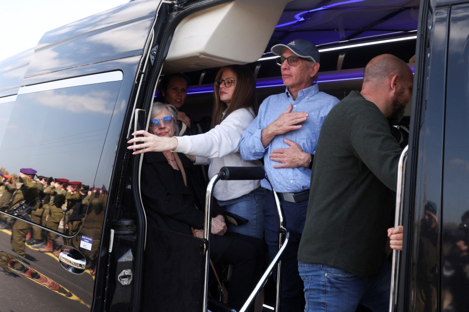 Family members in a van during a funeral procession.
