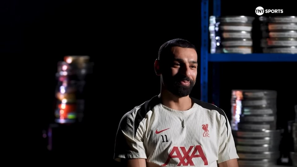 Mohamed Salah in a Liverpool jersey, discussing his ambitions.