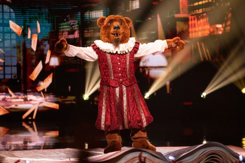 Bear in a Renaissance costume on a large book.