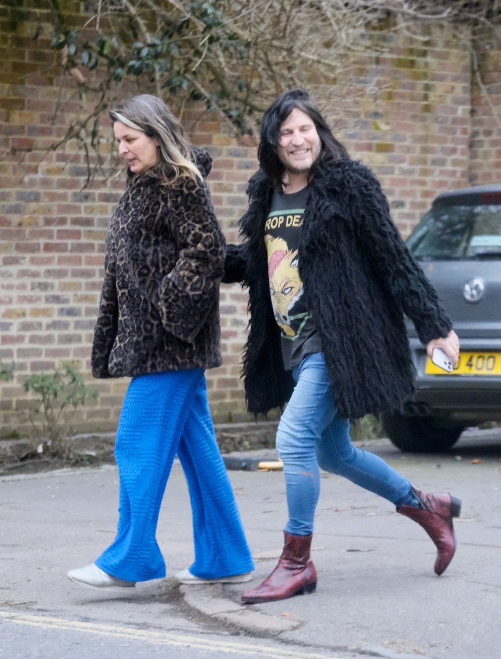 Noel Fielding walking with his wife and a friend.