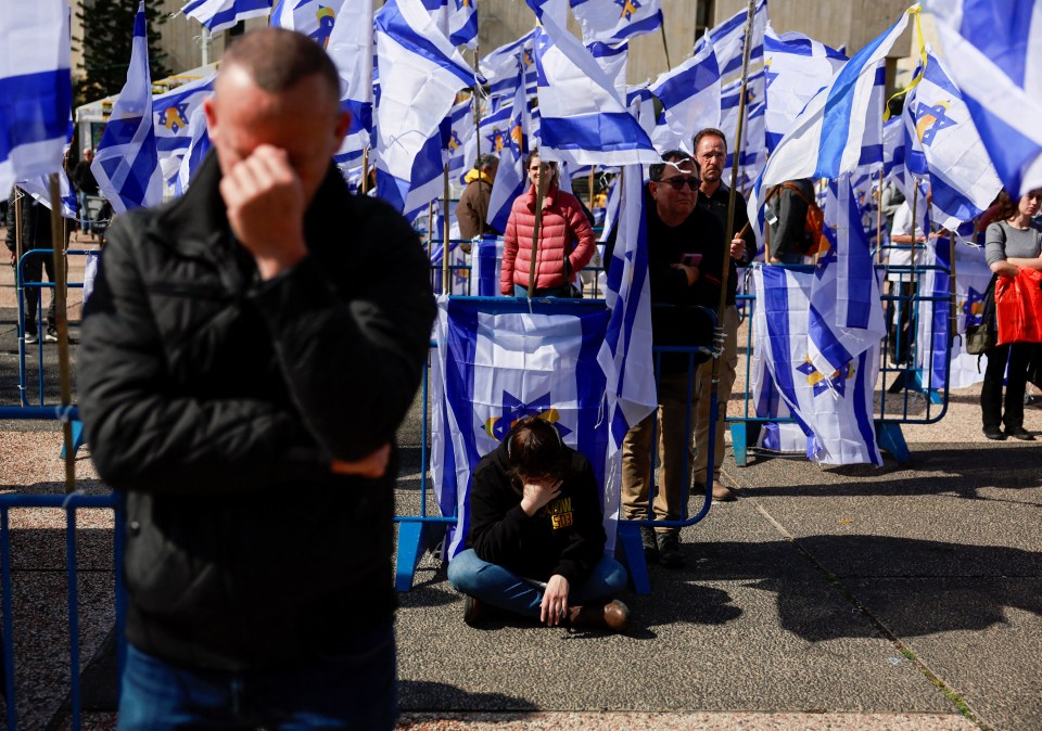 Mourners react to the return of Israeli hostages' bodies.