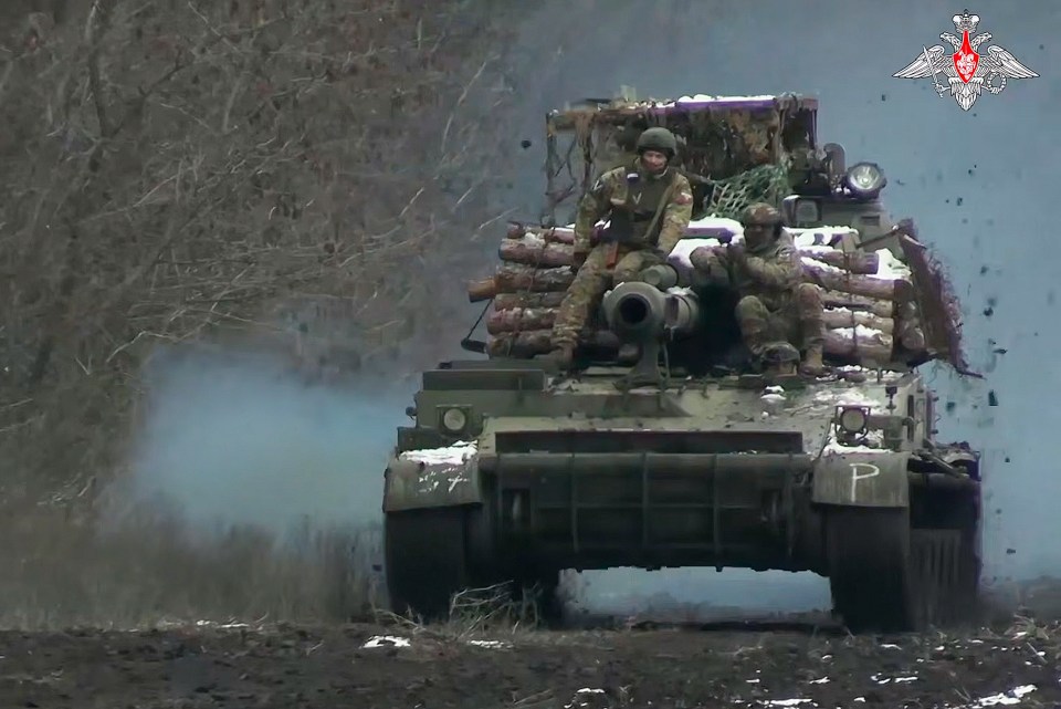 Russian soldiers on an Akatsiya self-propelled gun in eastern Ukraine.