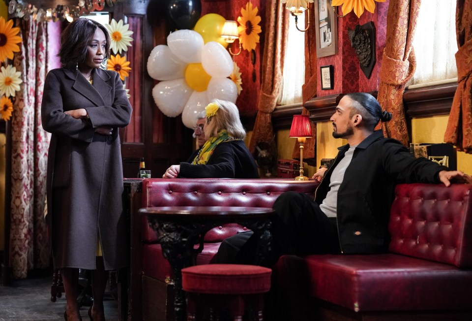 Denise Fox and Ravi Gulari in a pub scene.