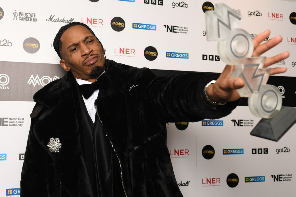 Scorcher accepting his MOBO Award for Grime Act of the Year.