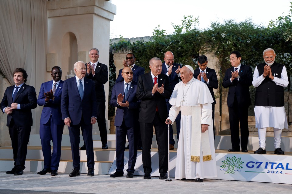 Group photo of G7 leaders and other world leaders, including Pope Francis.