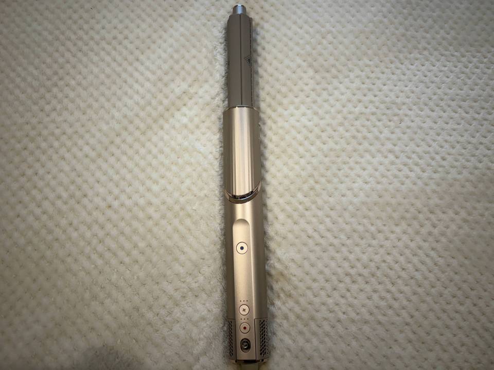 Gold hair styling tool.