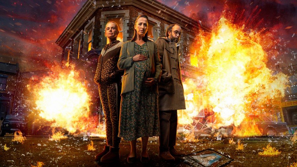 Promotional image of three EastEnders characters amidst a fiery explosion.