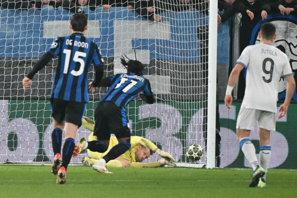 Goalkeeper diving to stop a penalty kick.