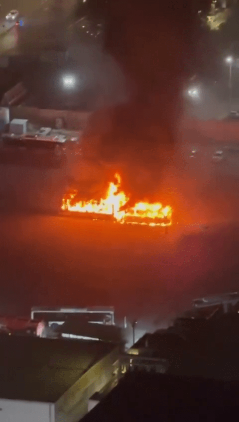 Large fire burning intensely at night.
