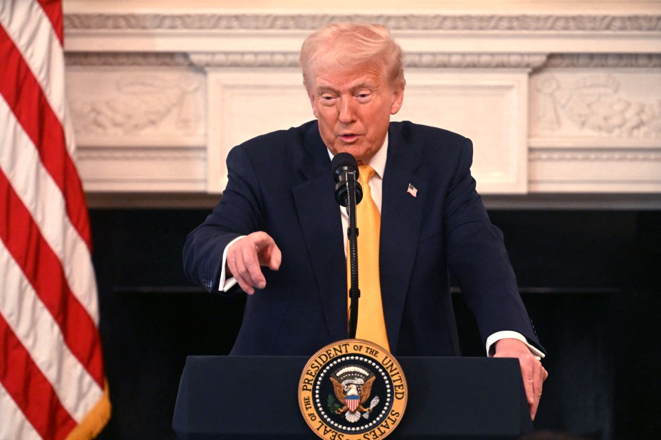 President Trump speaking at a podium.