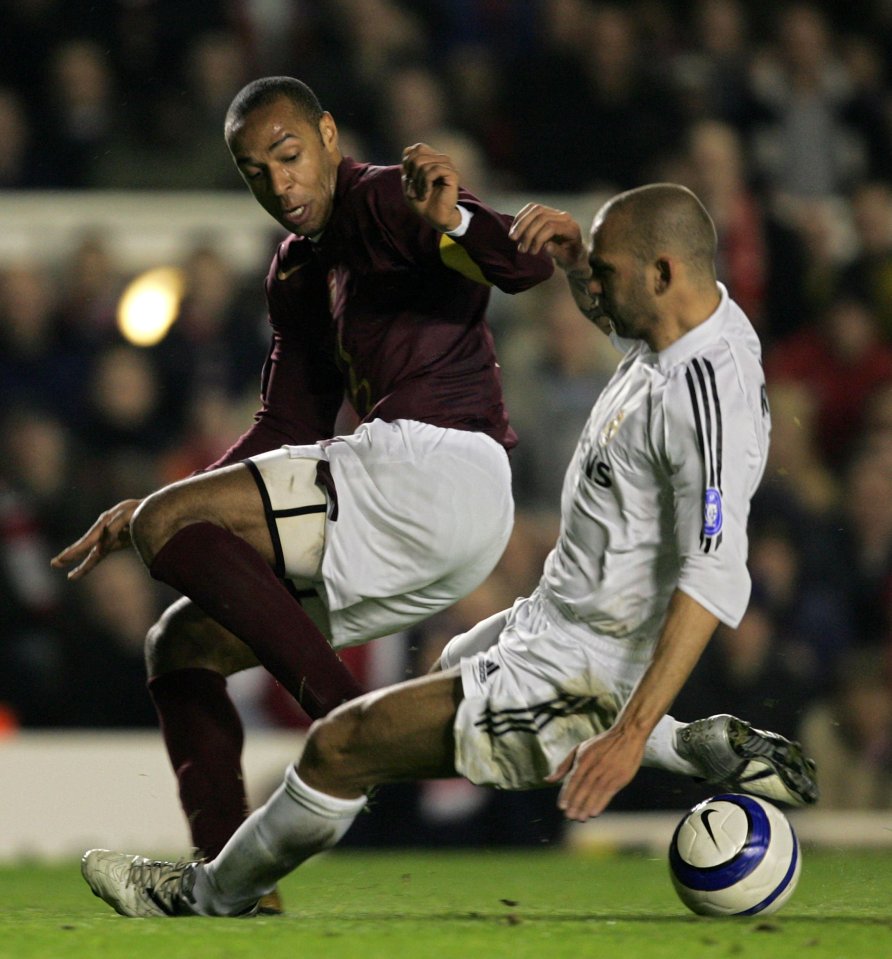 Thierry Henry and Raúl Bravo vying for the ball during a Champions League match.