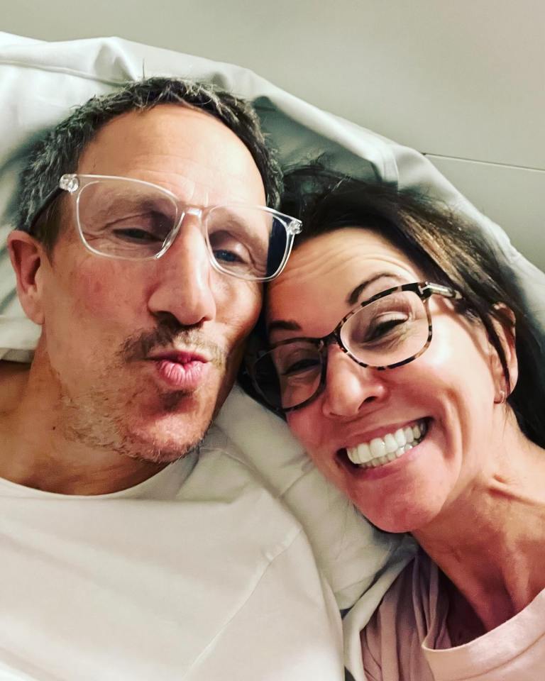 Selfie of a couple in bed.