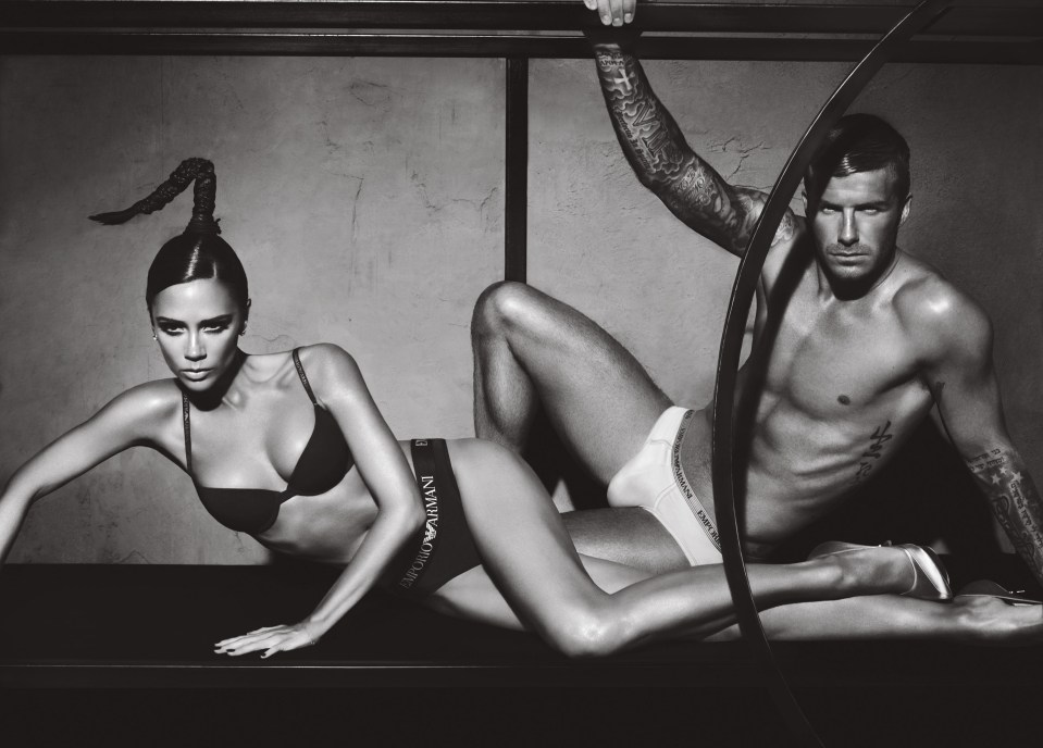 Black and white photo of David and Victoria Beckham in Emporio Armani underwear.