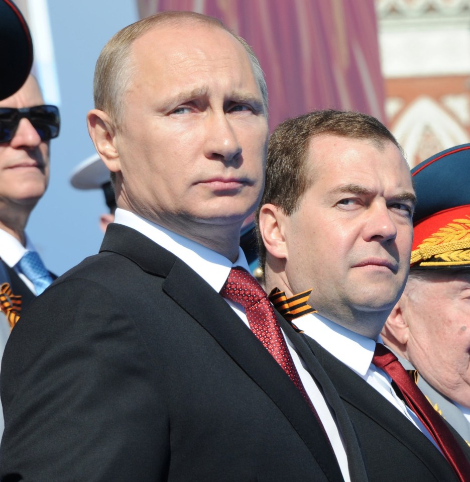 Vladimir Putin and Dmitry Medvedev at a Victory Day parade in Moscow.
