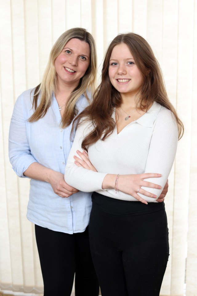 A mother and her 17-year-old daughter pose for a photo.